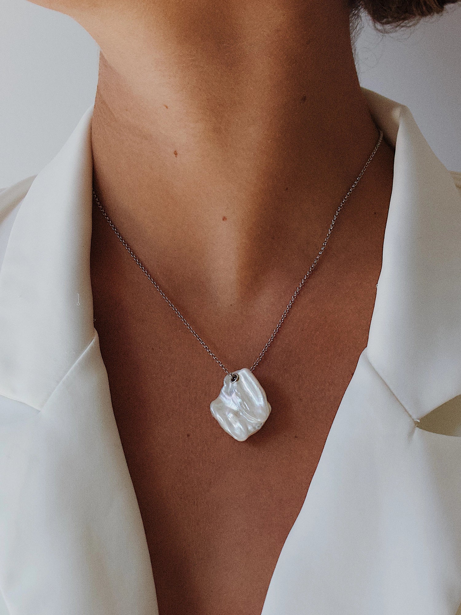 Lily Necklace - mixed-size white baroque freshwater pearls in sterling silver, 16-18in by Nishi Pearls, worn on a model